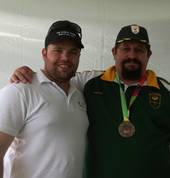 Dr Ferreira with the Coach of RSA tug of war team during the world games